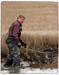 Local Man Collecting Oysters in Mud - Chincoteague Island, Virginia